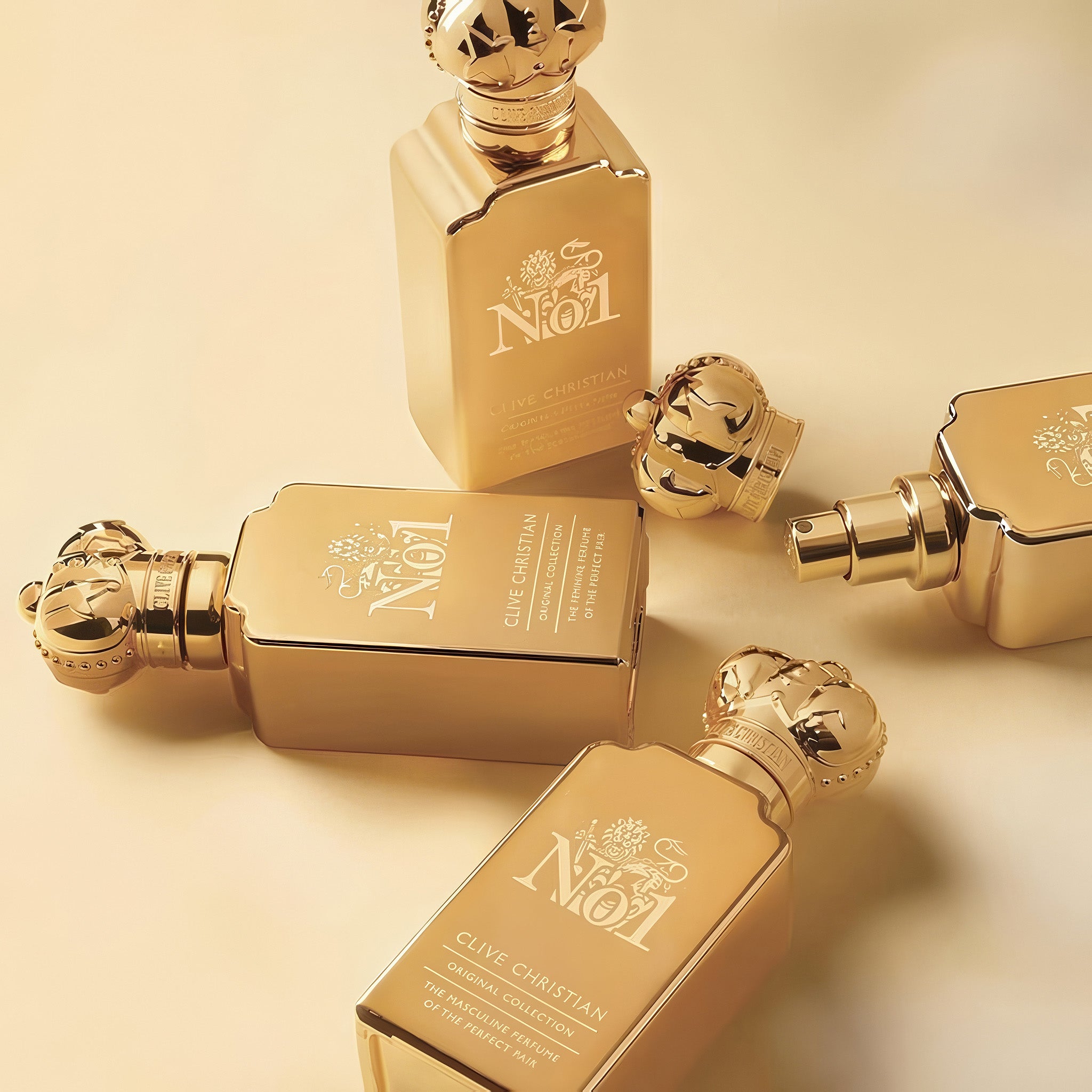 Gold Clive Christian No 1 The Masculine Perfume original collection perfume bottles on a golden background